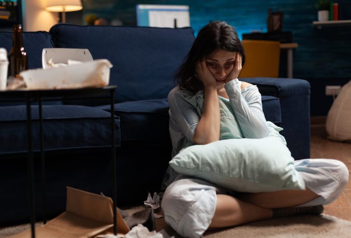 Lonely, traumatised, frustrated, ill woman holding head in hands, feeling vulnerable, desperate having bipolar problems, needs psychological help, major heartbroken experiencing loneliness crisis